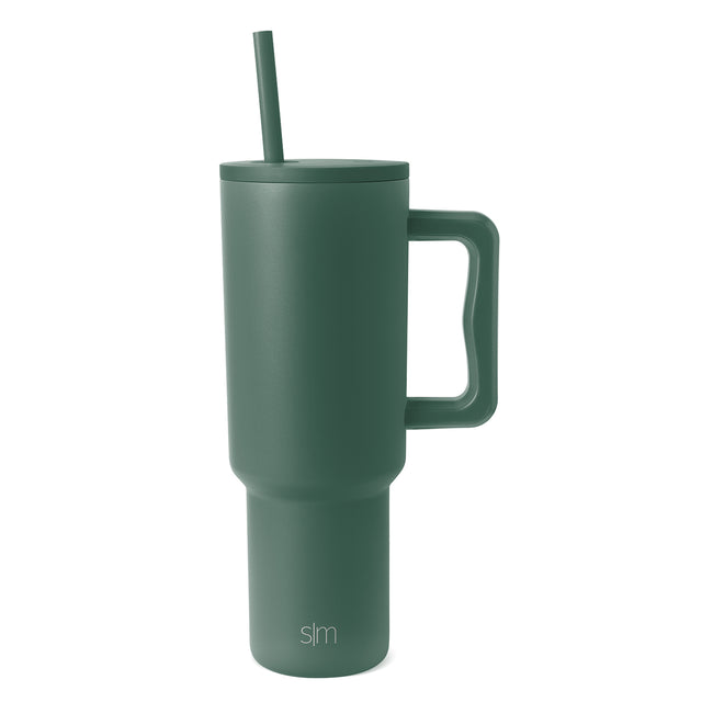 Sage green Trek Tumbler with matching handle and straw on white background Sage green Trek Tumbler with matching handle and straw on white background