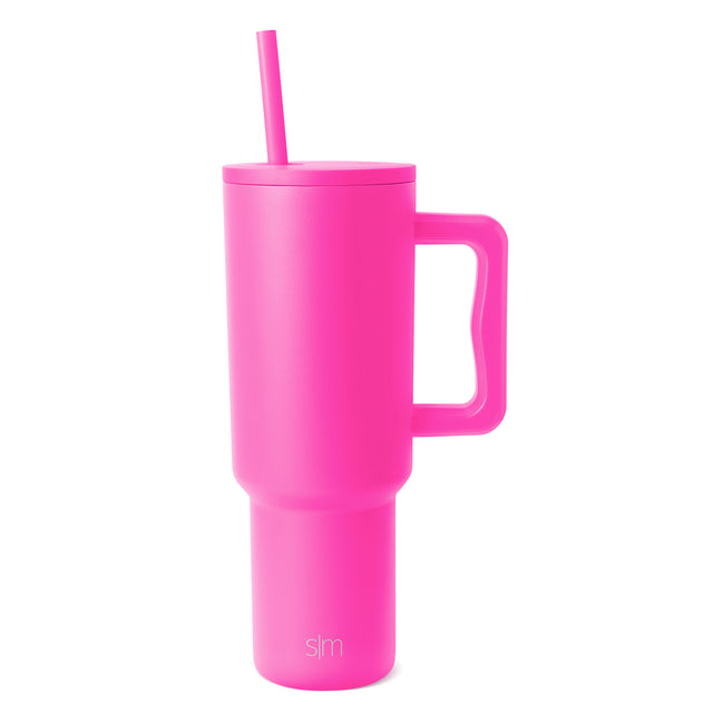 Hot pink Trek Tumbler with matching straw and handle, featuring Simple Modern logo, isolated on white background Hot pink Trek Tumbler with matching straw and handle, featuring Simple Modern logo, isolated on white background