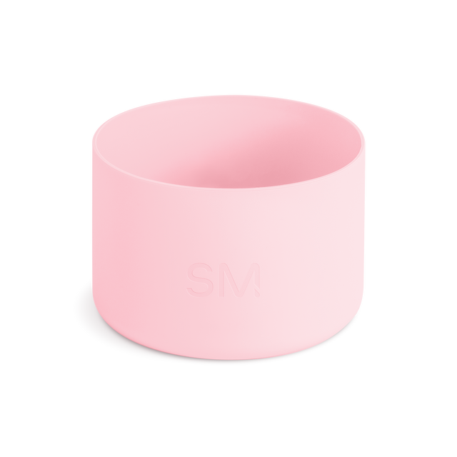 Pale pink cylindrical drinkware accessory on white background Pale pink cylindrical drinkware accessory on white background