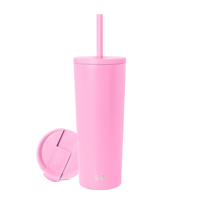 Light pink tumbler with matching lid and straw on white background Light pink tumbler with matching lid and straw on white background