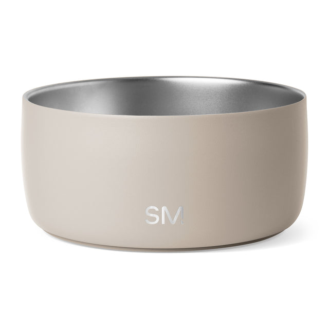 Beige ceramic bowl with soft cream exterior and brushed silver-gray metallic interior finish Beige ceramic bowl with soft cream exterior and brushed silver-gray metallic interior finish