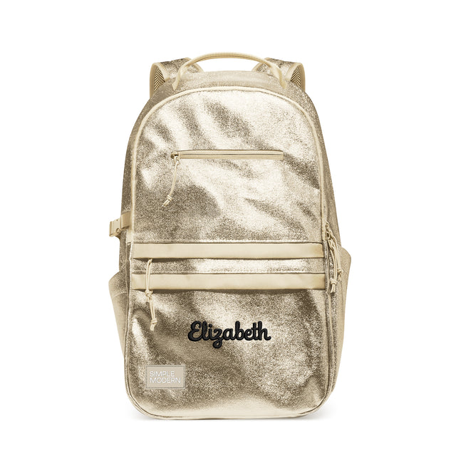 Champagne gold metallic backpack with cream straps, front elastic bands, padded shoulder straps, and mesh ventilation panels. Features Champagne gold metallic backpack with cream straps, front elastic bands, padded shoulder straps, and mesh ventilation panels. Features