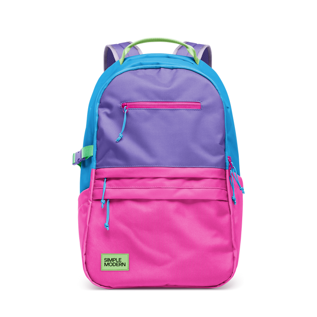 Colorful block design backpack with hot pink lower section, bright cyan blue side panels and top frame, and soft purple accents Colorful block design backpack with hot pink lower section, bright cyan blue side panels and top frame, and soft purple accents