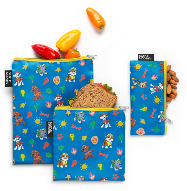 Three bright blue pouches of ESB LMS V PAW OTA M product with red, yellow, and orange bell peppers displayed at the top against a warm brown background. Three bright blue pouches of ESB LMS V PAW OTA M product with red, yellow, and orange bell peppers displayed at the top against a warm brown background.