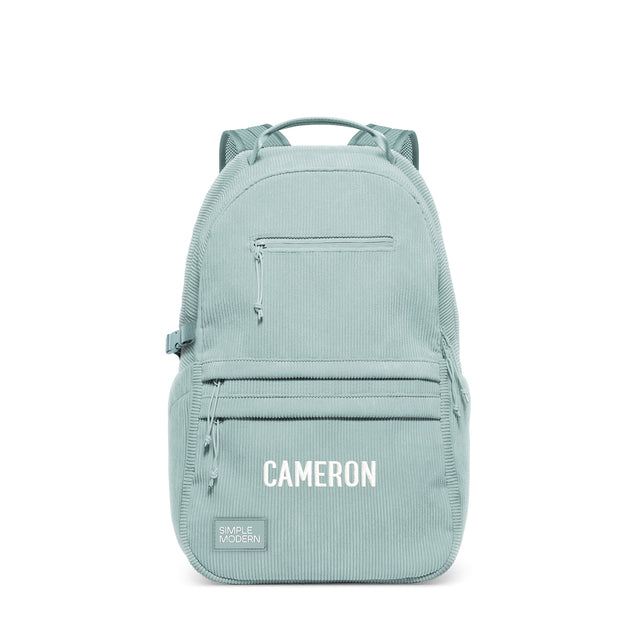 Sage green structured backpack with multiple zippered pockets, padded mesh shoulder straps, and top carry handle. Features Sage green structured backpack with multiple zippered pockets, padded mesh shoulder straps, and top carry handle. Features