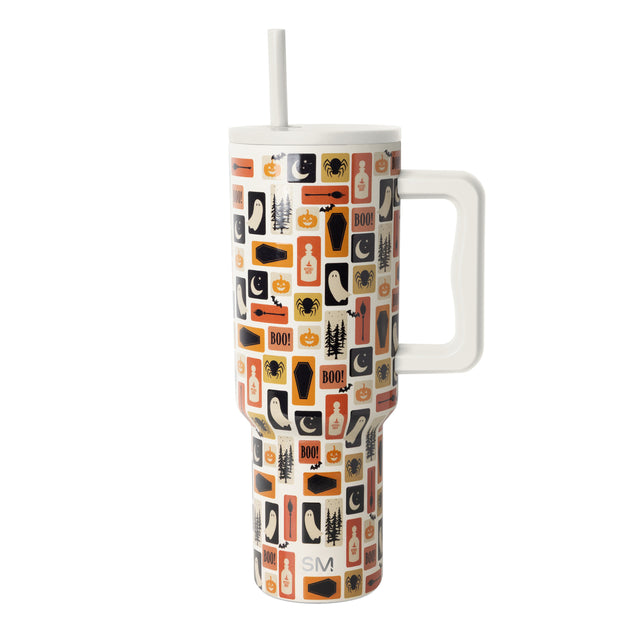 Tall stainless steel tumbler with handle in cream, orange, black, and tan striped pattern by Simple Modern on white background. Tall stainless steel tumbler with handle in cream, orange, black, and tan striped pattern by Simple Modern on white background.