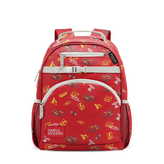 Red children's backpack with yellow racing graphics and gray webbing straps, featuring front zipper pocket, mesh side pockets, padded shoulder straps, and top carry handles. Red children's backpack with yellow racing graphics and gray webbing straps, featuring front zipper pocket, mesh side pockets, padded shoulder straps, and top carry handles.