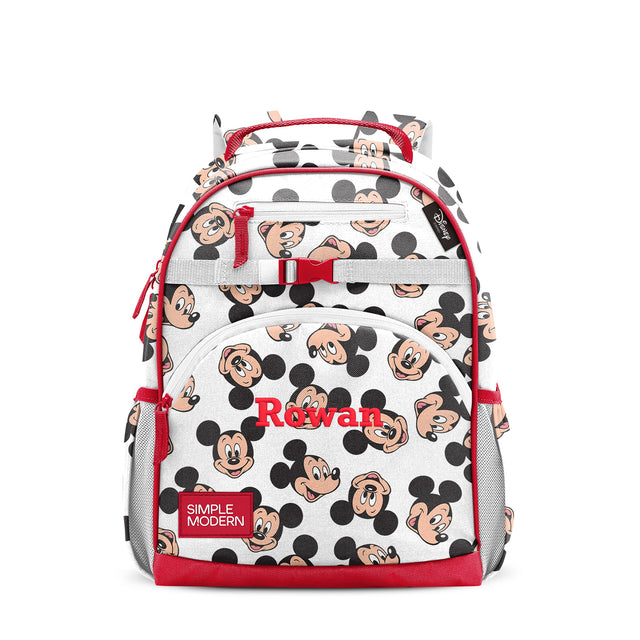 White children's backpack with red trim, black circles and peach character faces pattern, multiple zippered compartments, padded red straps, gray mesh side pockets, personalized with White children's backpack with red trim, black circles and peach character faces pattern, multiple zippered compartments, padded red straps, gray mesh side pockets, personalized with