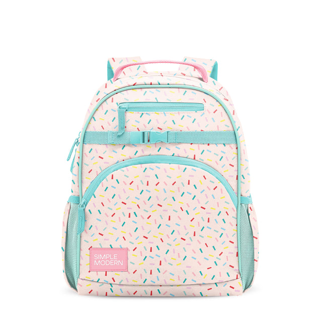 Pale pink children's backpack with turquoise trim, colorful confetti pattern, front pocket with Pale pink children's backpack with turquoise trim, colorful confetti pattern, front pocket with