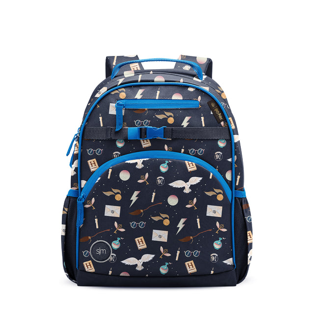 Navy blue children's backpack with bright blue accents, cream and pink Harry Potter-themed pattern. Features front zippered pocket, side mesh pockets, padded blue straps, grab handles, and SM logo badge. Navy blue children's backpack with bright blue accents, cream and pink Harry Potter-themed pattern. Features front zippered pocket, side mesh pockets, padded blue straps, grab handles, and SM logo badge.