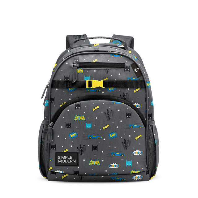 Batman-themed children's backpack in charcoal gray with bright yellow and blue accents, featuring Batman silhouettes, Batmobiles, comic book sound effects, white stars, yellow buckle, mesh pockets, and Simple Modern logo on Batman-themed children's backpack in charcoal gray with bright yellow and blue accents, featuring Batman silhouettes, Batmobiles, comic book sound effects, white stars, yellow buckle, mesh pockets, and Simple Modern logo on