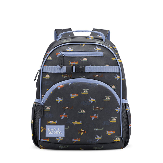 Charcoal gray children's backpack with periwinkle blue accents, padded shoulder straps, front zippered pocket, and print pattern featuring golden yellow aircraft and sailboat silhouettes. Simple Modern brand patch on front. Charcoal gray children's backpack with periwinkle blue accents, padded shoulder straps, front zippered pocket, and print pattern featuring golden yellow aircraft and sailboat silhouettes. Simple Modern brand patch on front.