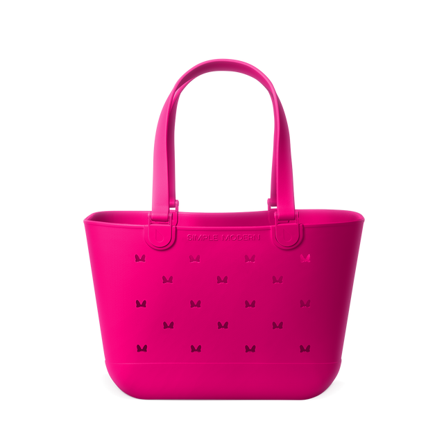 Hot pink magenta tote bag displayed against a white background Hot pink magenta tote bag displayed against a white background