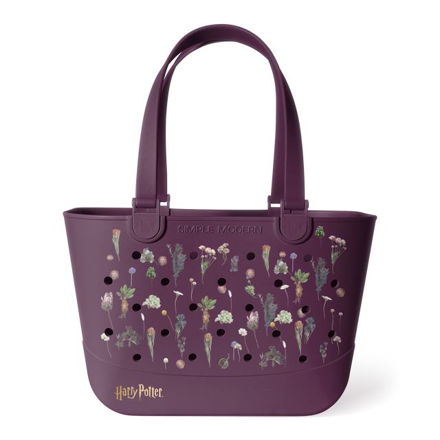 Plum purple Simple Modern Harry Potter tote bag with dual handles, featuring botanical wildflower illustrations and black perforations across the front, displayed on white background. Plum purple Simple Modern Harry Potter tote bag with dual handles, featuring botanical wildflower illustrations and black perforations across the front, displayed on white background.