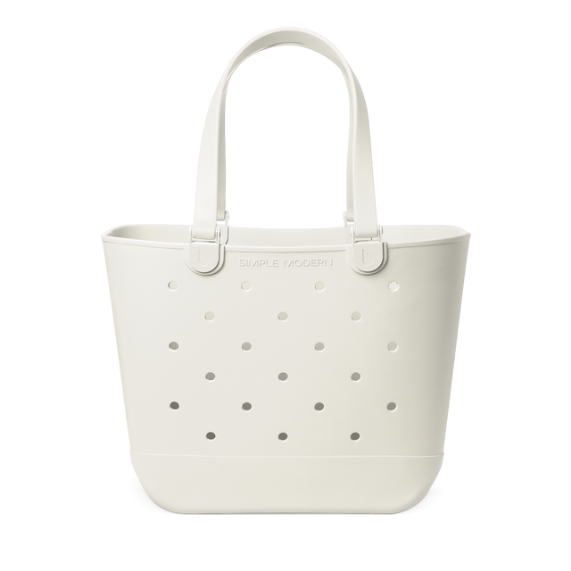 Cream-colored silicone tote bag with gray circular perforations pattern Cream-colored silicone tote bag with gray circular perforations pattern