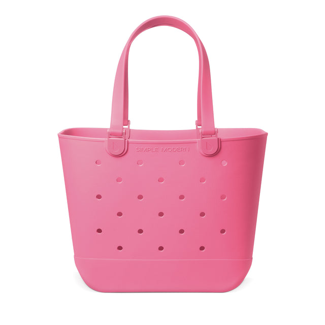 Vibrant hot pink coral tote bag displayed against a white background Vibrant hot pink coral tote bag displayed against a white background