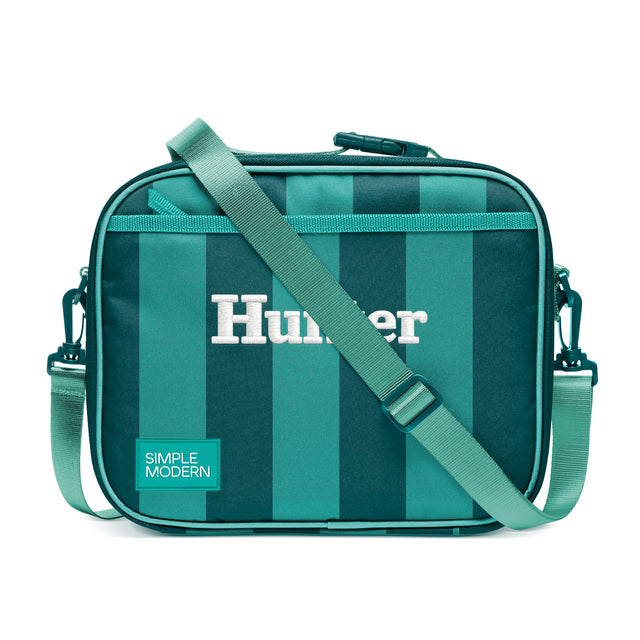 Simple Modern Hunter crossbody lunch bag with teal and turquoise vertical stripes, adjustable shoulder strap, top zipper closure, and side handles on white background. Simple Modern Hunter crossbody lunch bag with teal and turquoise vertical stripes, adjustable shoulder strap, top zipper closure, and side handles on white background.