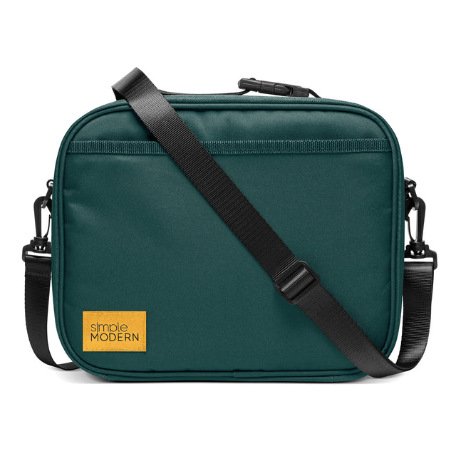 Teal crossbody bag with golden yellow brand accent Teal crossbody bag with golden yellow brand accent