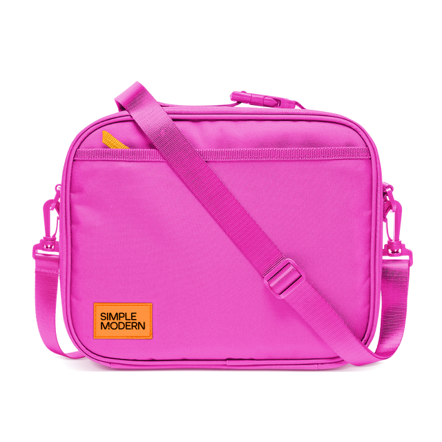 Hot pink shoulder bag with bright yellow-orange zipper pulls and branding accents Hot pink shoulder bag with bright yellow-orange zipper pulls and branding accents