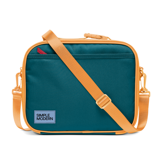 Deep teal canvas bag with apricot orange trim, piping, handles, and shoulder strap Deep teal canvas bag with apricot orange trim, piping, handles, and shoulder strap
