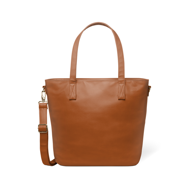 Brown leather tote bag with gold-toned metal hardware, front view on white background Brown leather tote bag with gold-toned metal hardware, front view on white background
