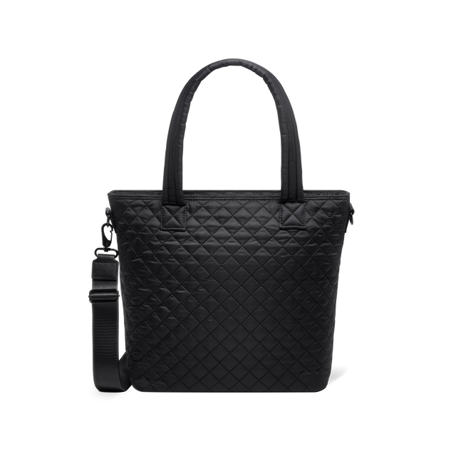 Black tote bag with charcoal tones, dual handles, and detachable shoulder strap displayed against a white background Black tote bag with charcoal tones, dual handles, and detachable shoulder strap displayed against a white background