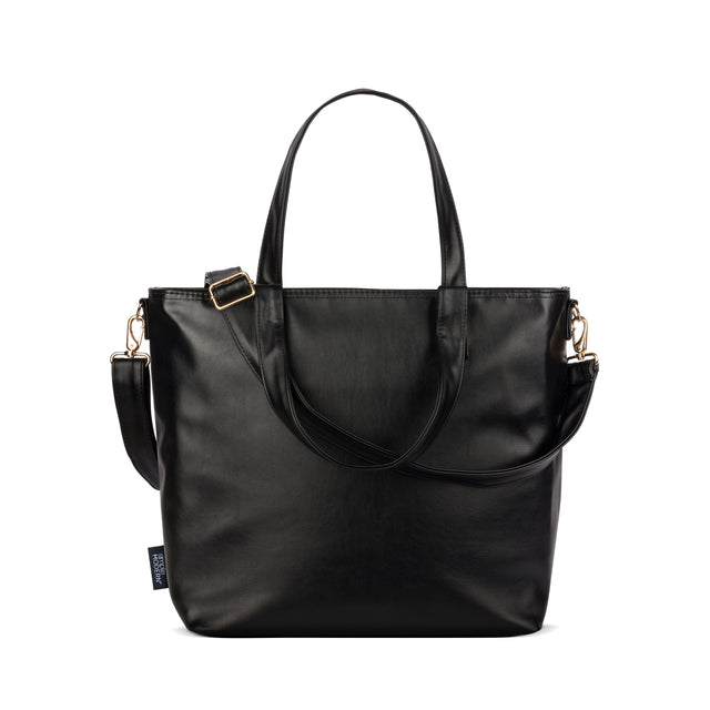 Black tote bag with gold and rose gold metal hardware accents, including buckle details and fittings on straps and shoulder strap Black tote bag with gold and rose gold metal hardware accents, including buckle details and fittings on straps and shoulder strap