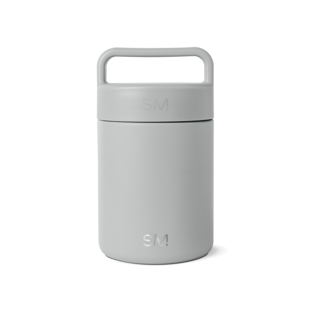 Gray-silver cylindrical jar with handle on white background Gray-silver cylindrical jar with handle on white background