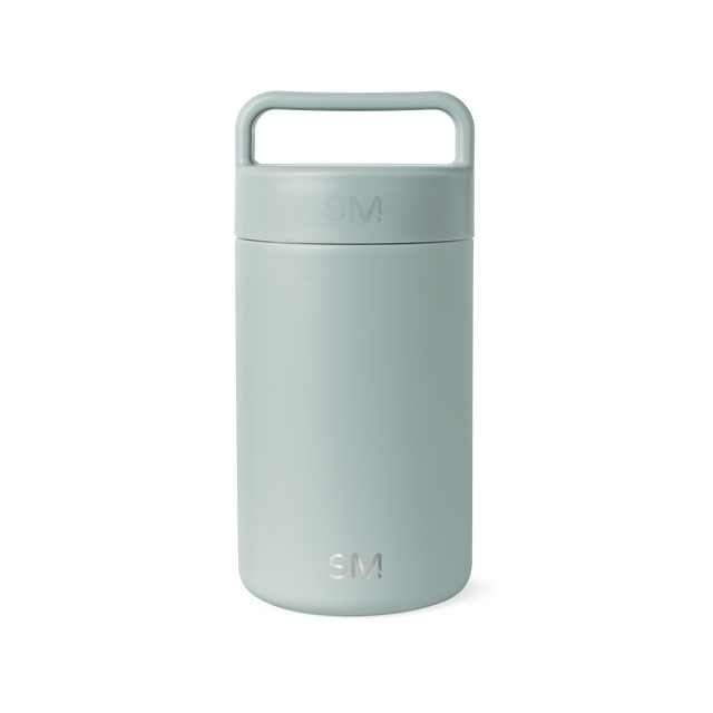 Sage green cylindrical insulated container with matte finish and integrated handle on white background Sage green cylindrical insulated container with matte finish and integrated handle on white background