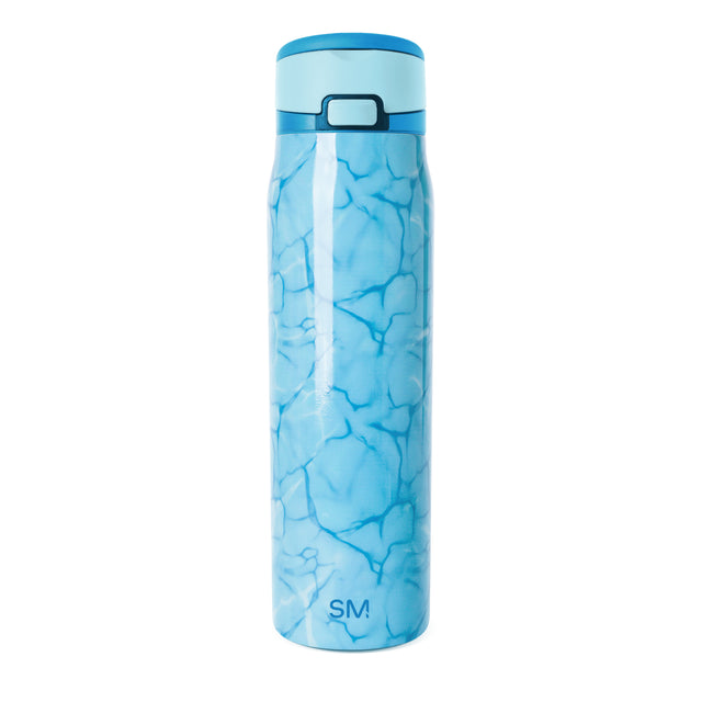 Blue stainless steel water bottle with flip-top cap and aquatic pattern design, featuring darker blue water-inspired shapes on light blue gradient background, Simple Modern SM logo visible on front. Blue stainless steel water bottle with flip-top cap and aquatic pattern design, featuring darker blue water-inspired shapes on light blue gradient background, Simple Modern SM logo visible on front.
