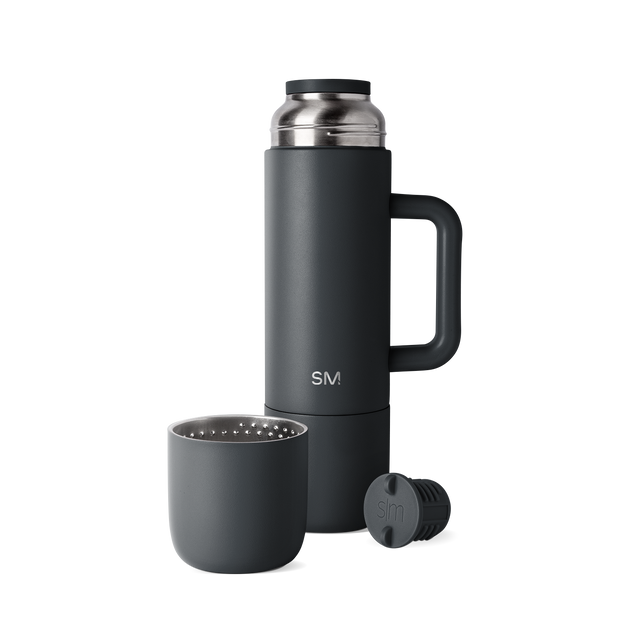 Deep charcoal black and dark gunmetal gray drinkware set with matte finish and brushed metal accents Deep charcoal black and dark gunmetal gray drinkware set with matte finish and brushed metal accents