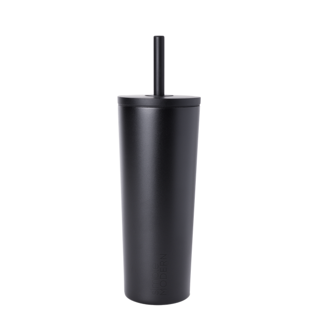 Matte black reusable cup with matching black straw on white background Matte black reusable cup with matching black straw on white background