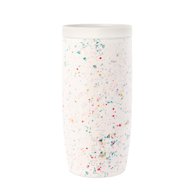 White cylindrical tumbler with colorful confetti speckle pattern throughout, product shot on neutral background White cylindrical tumbler with colorful confetti speckle pattern throughout, product shot on neutral background