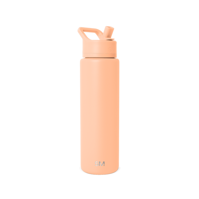 Tall cylindrical water bottle in soft peachy-coral color with ergonomic handle and modern tapered design Tall cylindrical water bottle in soft peachy-coral color with ergonomic handle and modern tapered design