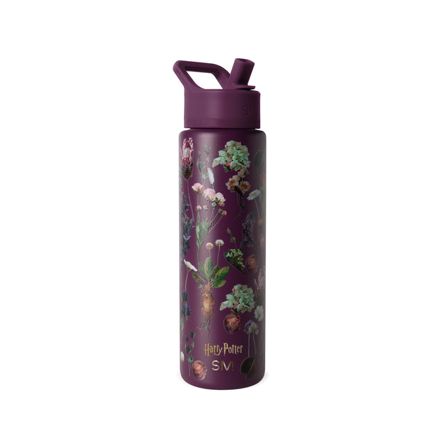 Deep burgundy water bottle with botanical illustrations in soft muted tones on purple background Deep burgundy water bottle with botanical illustrations in soft muted tones on purple background
