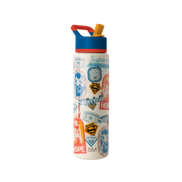 Simple Modern insulated water bottle with cream base, color-block red and blue top, and golden yellow spout cap. Features Superman-themed graphics including shields, Simple Modern insulated water bottle with cream base, color-block red and blue top, and golden yellow spout cap. Features Superman-themed graphics including shields,