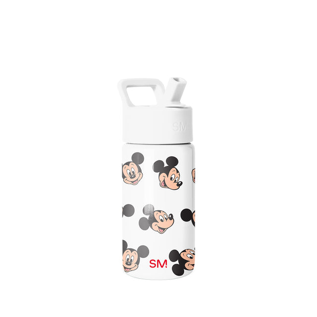 Simple Modern white water bottle with Mickey Mouse character faces in peach, black, and gray, featuring a carrying handle and straw lid, SM logo on lower body. Simple Modern white water bottle with Mickey Mouse character faces in peach, black, and gray, featuring a carrying handle and straw lid, SM logo on lower body.