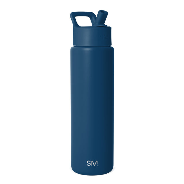 Navy blue Simple Modern insulated water bottle with flip-top spout and carry handle, displayed against white background. SM logo visible on front. Navy blue Simple Modern insulated water bottle with flip-top spout and carry handle, displayed against white background. SM logo visible on front.