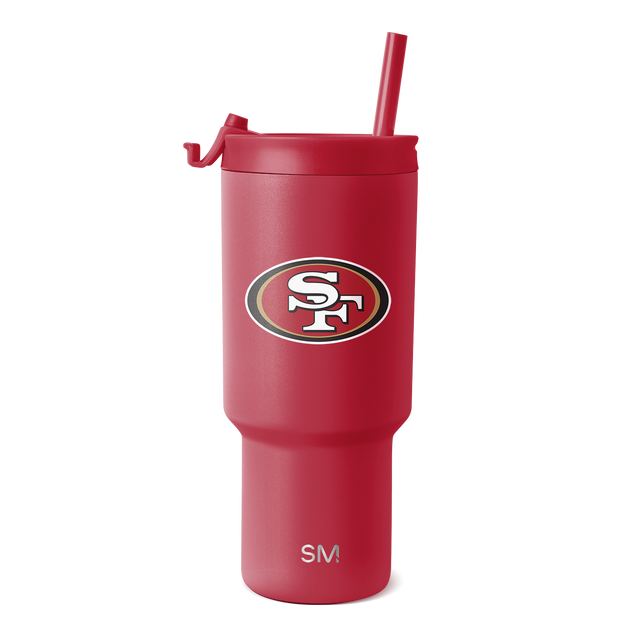 Red tumbler with matching lid, handle, and straw on white background Red tumbler with matching lid, handle, and straw on white background