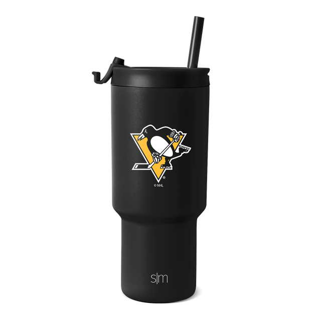 Matte black tumbler with gold and white logo accents on white background Matte black tumbler with gold and white logo accents on white background