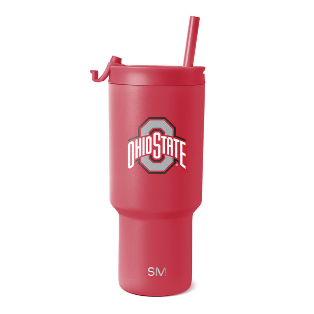Vibrant coral-red tumbler with matching red straw and lid closure on white background. Vibrant coral-red tumbler with matching red straw and lid closure on white background.