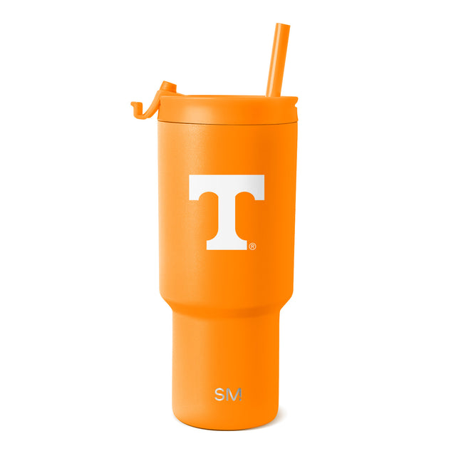 Bright orange tumbler with matching orange straw on white background Bright orange tumbler with matching orange straw on white background