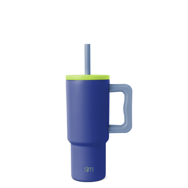 Navy blue tumbler with vibrant lime green lid, rim band, and handle for secure grip and easy carrying. Navy blue tumbler with vibrant lime green lid, rim band, and handle for secure grip and easy carrying.