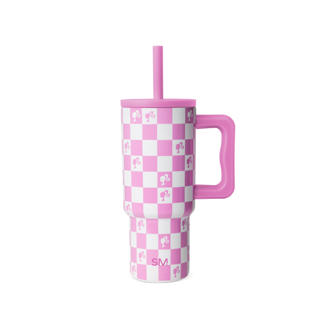 Pink and white checkerboard tumbler with matching straw on white background Pink and white checkerboard tumbler with matching straw on white background