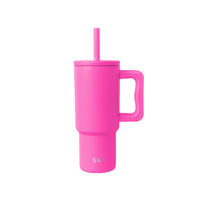 Hot pink reusable drinkware with lid on white background Hot pink reusable drinkware with lid on white background