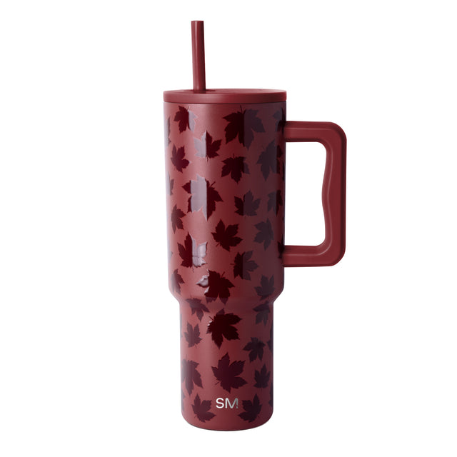 Dusty burgundy mug with scattered deep maroon and wine-colored leaf pattern throughout Dusty burgundy mug with scattered deep maroon and wine-colored leaf pattern throughout