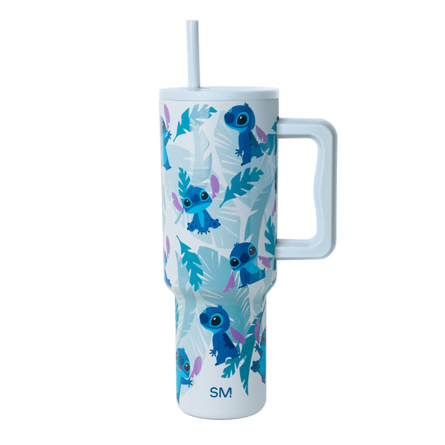 Pale blue tumbler with royal blue, teal, cyan, and purple botanical leaf accents Pale blue tumbler with royal blue, teal, cyan, and purple botanical leaf accents
