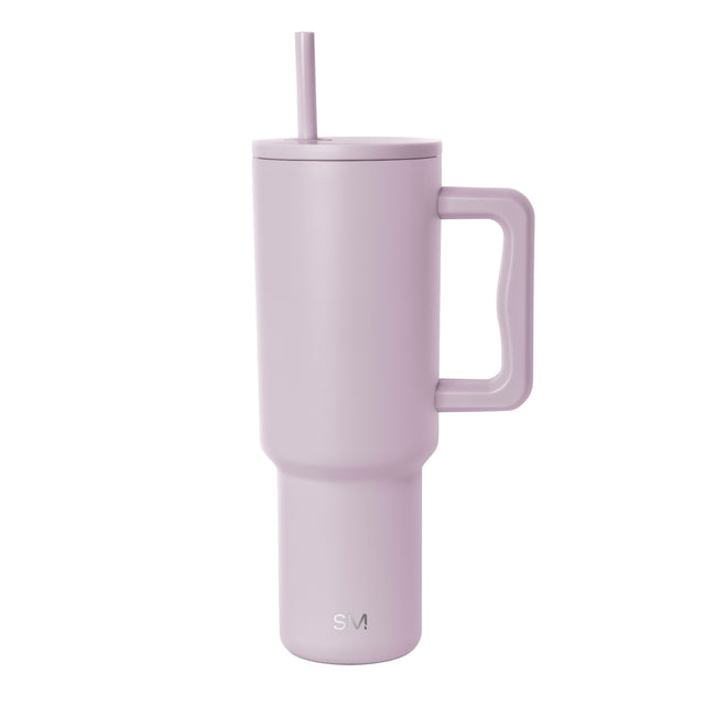 Mauve 40-ounce insulated travel tumbler with matching handle and lid with straw, shown against white background. Simple Modern logo visible on lower front. Mauve 40-ounce insulated travel tumbler with matching handle and lid with straw, shown against white background. Simple Modern logo visible on lower front.