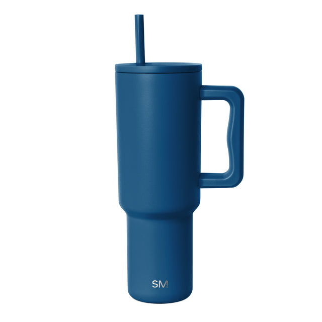 Deep teal insulated tumbler with handle and matching lid featuring integrated straw. Simple Modern logo displayed on body. Studio product shot on white background. Deep teal insulated tumbler with handle and matching lid featuring integrated straw. Simple Modern logo displayed on body. Studio product shot on white background.