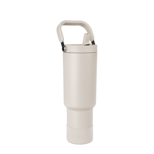 Off-white cream portable storage product with matte black carrying handle and metallic silver hardware details Off-white cream portable storage product with matte black carrying handle and metallic silver hardware details